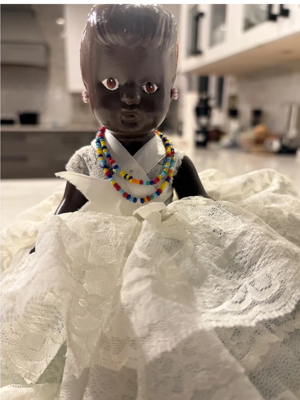 Classic Black Doll in White Lace Dress with Colorful Bead Necklaces